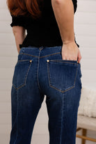 woman modeling the back pockets and showing close up of the deetails on mac and me barely boot denim 