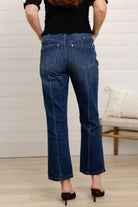 woman modeling back of w mac and me barely boot denim in dark blue color with black top by Mac and Me 