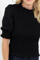 close up view of Mac and Me black 3/4 sleeve smocked top