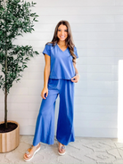 model in blue short sleeve mac and me meet and tank top