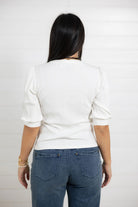 Back view of white ribbed elbow sleeve boutique top