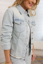 closeup of Mac and Me bleached blue ruched sleeve denim jacket with fray hem