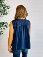 Back view of navy sleeveless gathered blouse for women
