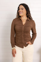 woman modeling the ruched front button down in chocolate brown