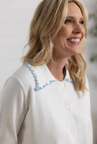 details on Mac and Me ivory ruffle collar sweater with blue lettuce trim