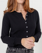 close up look at the mac and me solid black button front cardigan layering sweater