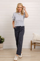 model wearing women’s straight leg utility pants with pull on fit in color Orion (Navy)