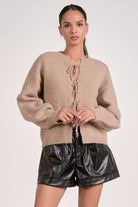Woman wearing macchiato tie-front cropped cozy knit sweater for women