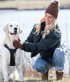 lifestyle shot of a girl in knit tech touchscreen gloves with cozy cuff detail in a brown color.
