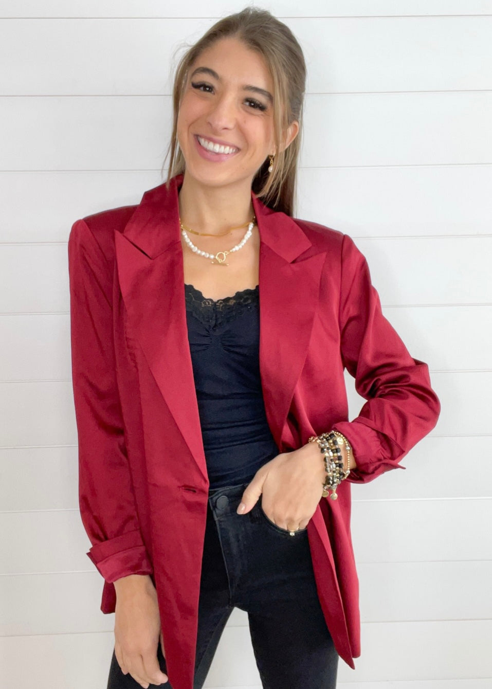 maroon satin tailored blazer on hanger with structured silhouette shown styled open