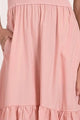 close up view of color and fabric on bottom of blush ribbed knit mixed media midi dress with tiered skirt and pockets