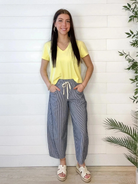 model showing front of navy striped loose fit pants with Mac and Me v neck top in sunshine yellow