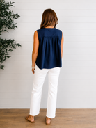 model showing back of sleeveless navy tie front top