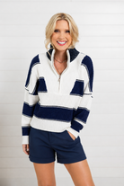 woman modeling blue and white stripe sweater and shorts