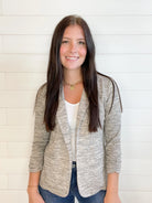 young lady wearing a Toffee knit blazer with shirred sleeves front view