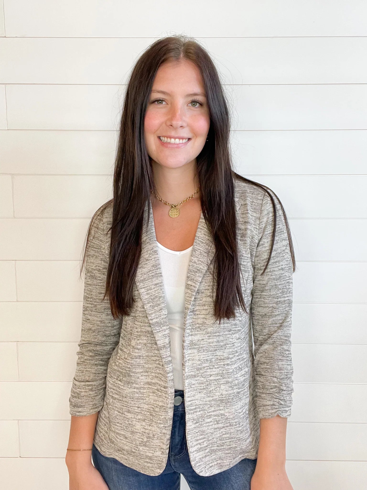 young lady wearing a Toffee knit blazer with shirred sleeves front view