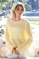 Butter yellow crochet open knit sweater on model