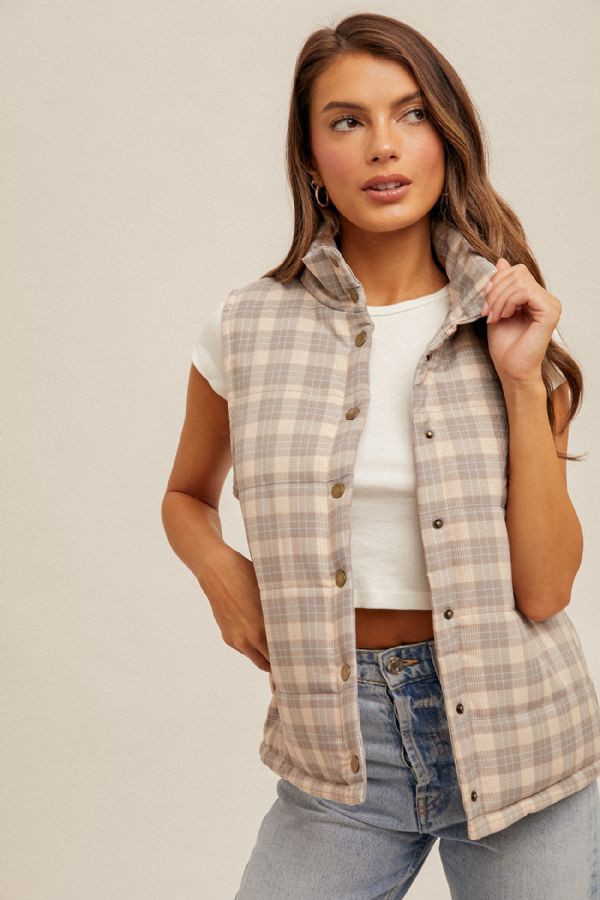 Girl wearing plaid vest 