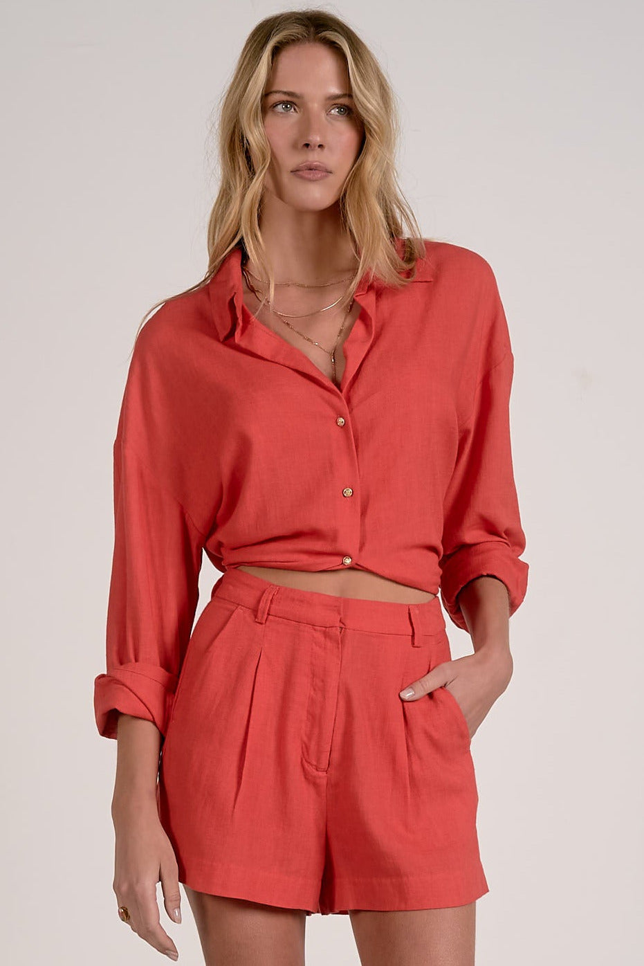 red collared shirt women long tied in back for a chic fitted look