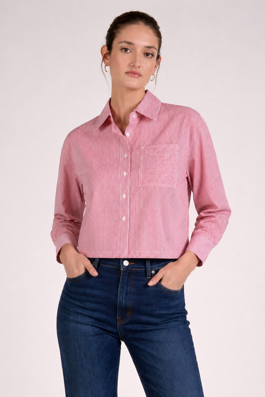 Red stripe button front top with collared neckline, button front closure, and front pocket detail paired with dark denim