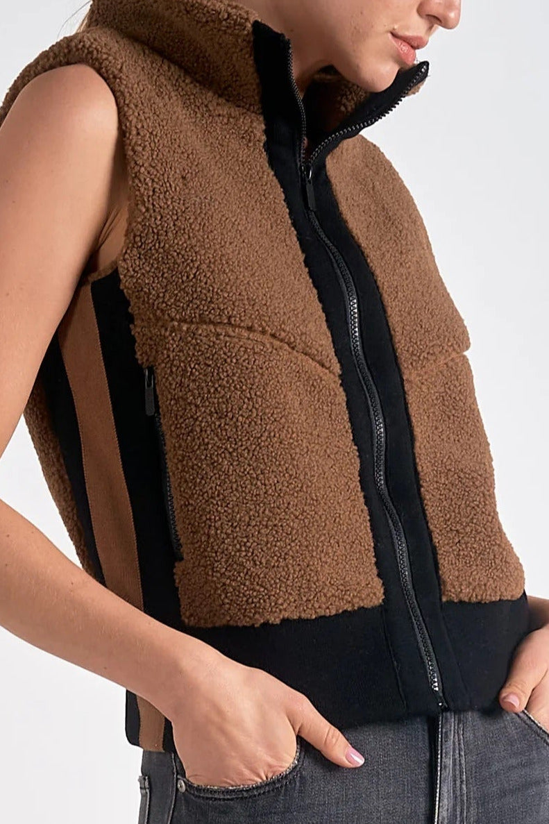 Details on the dark tan sherpa vest