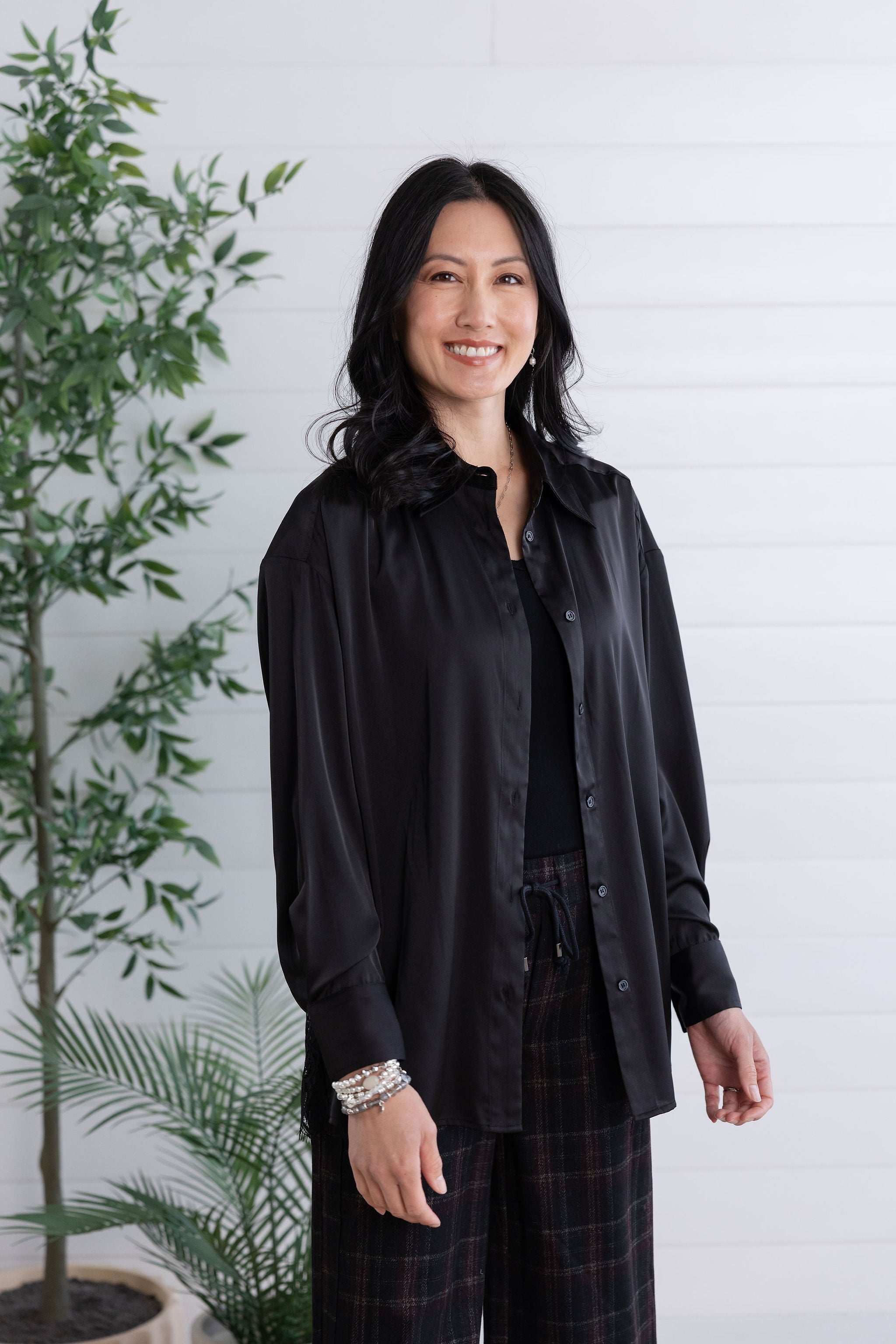 front view and unbuttoned black lace-back button down