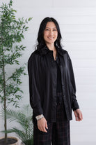 front view and unbuttoned black lace-back button down