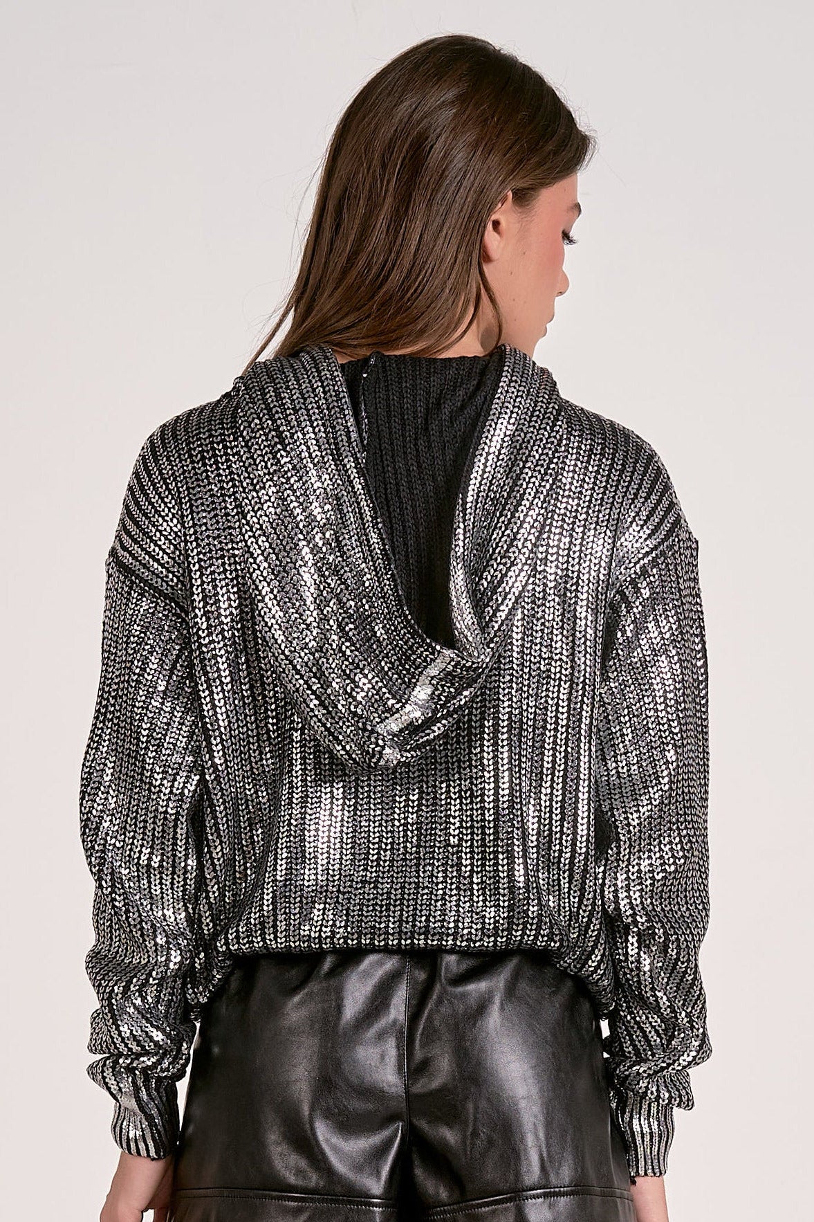 Back view of the silver Metallic Hoodie Sweater with relaxed fit and subtle shimmer from Mainstream Boutique Bloomington.