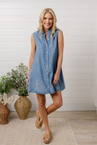 model showing front of button front shirt dress with embroidered details