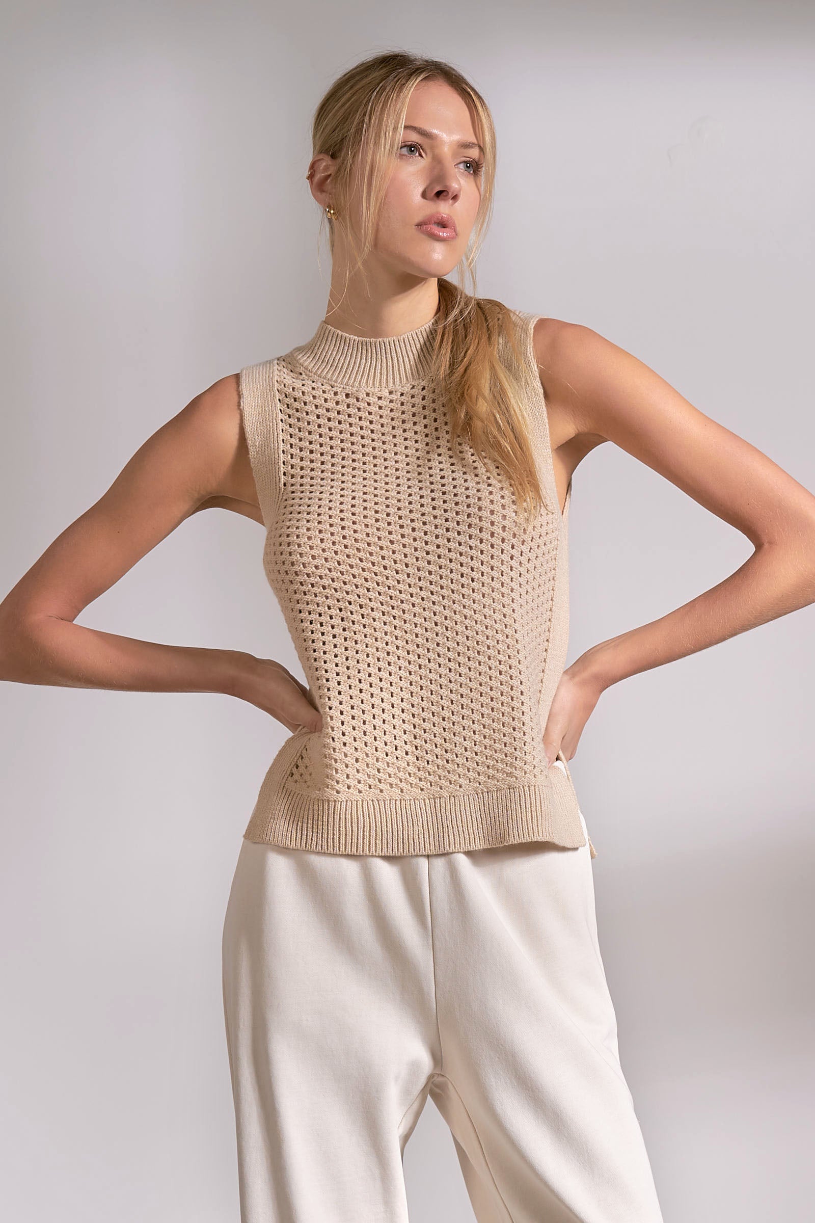 sand sleeveless knit sweater with textured design front view