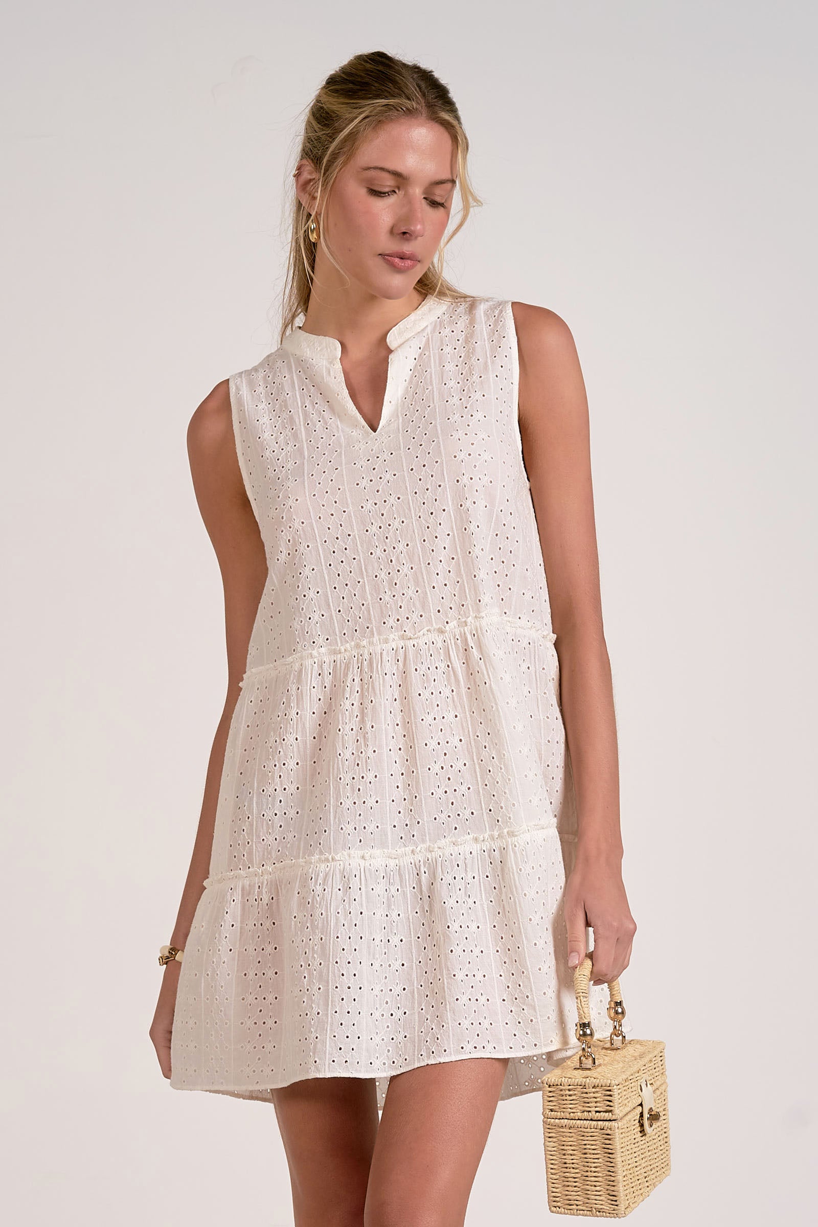 front of sleeveless tiered eyelet dress in white
