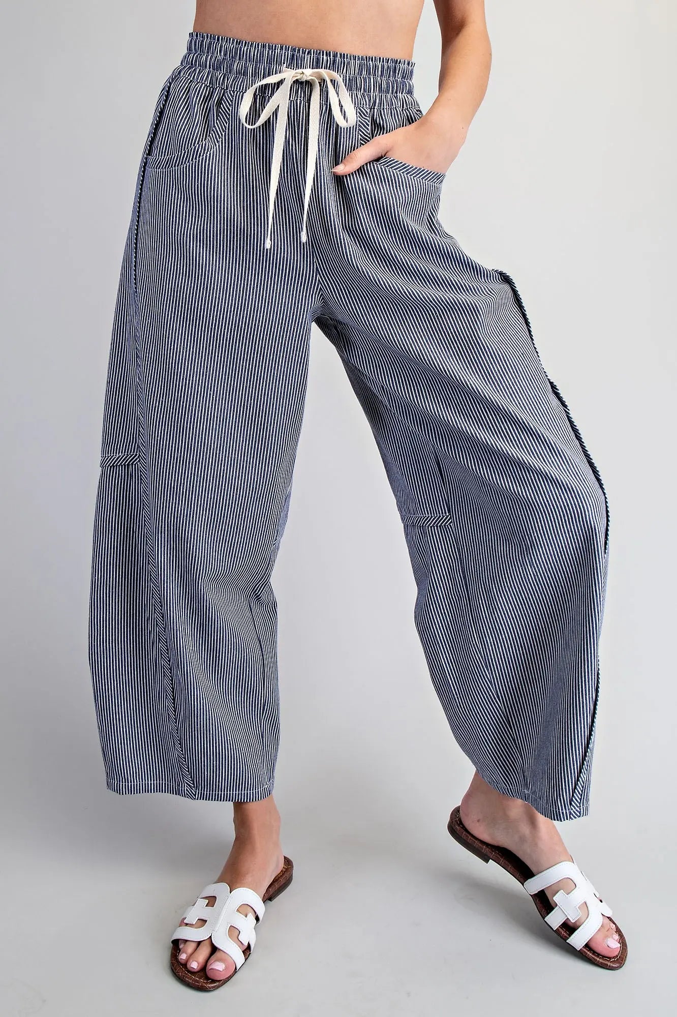 Relaxed fit navy striped pants with elastic waistband and pockets