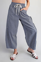 Relaxed fit navy striped pants with elastic waistband and pockets