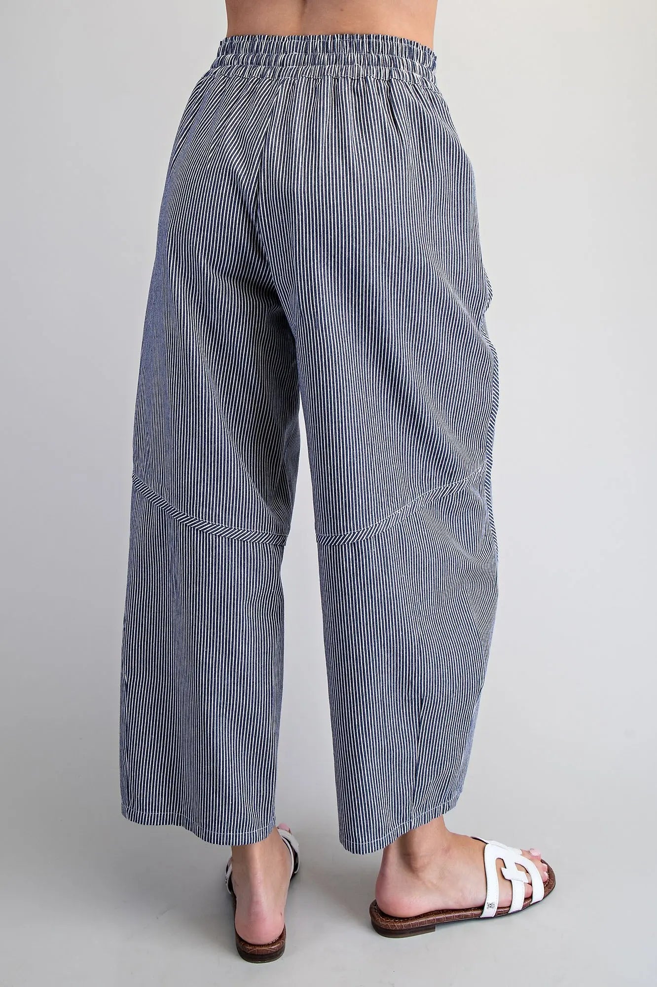 Back view of navy striped cropped wide leg pants