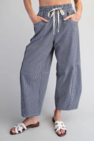 Relaxed fit navy striped pants with elastic waistband and pockets