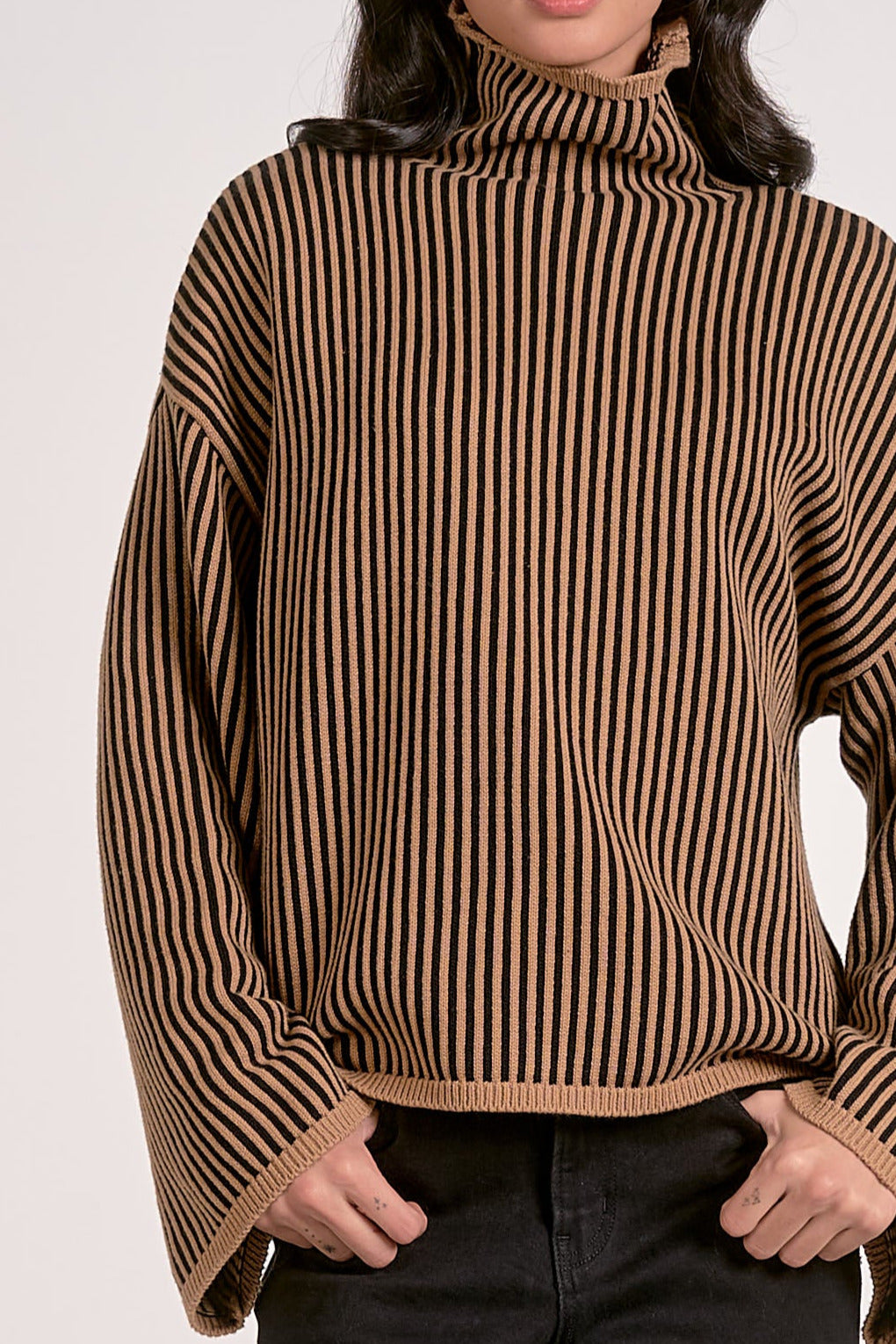 front view details on relaxed fit striped mock neck sweater tan and black