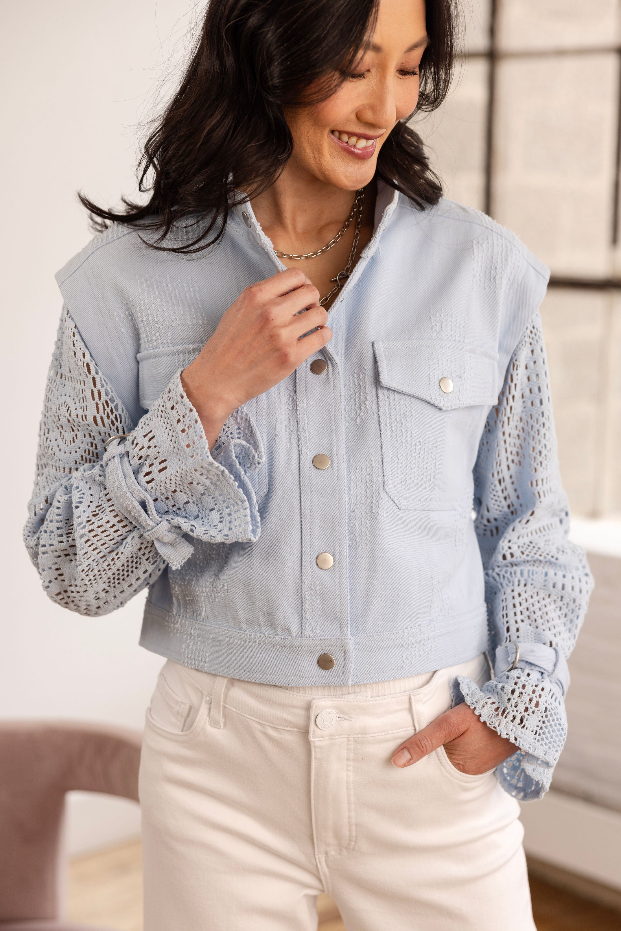 Denim jacket with crochet sleeves in blue breeze front view