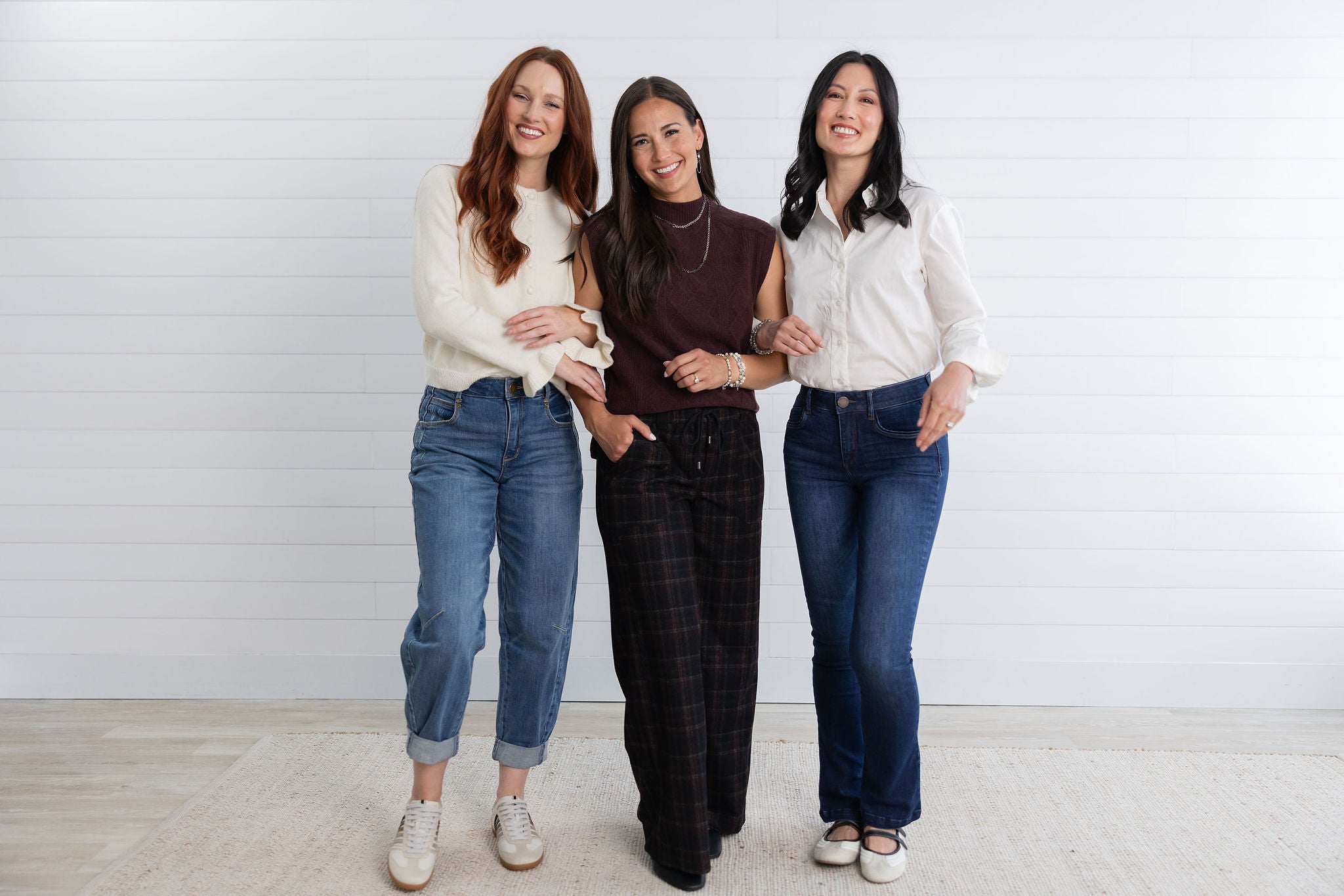 three girls posing for a mainstream boutique fashion photo
