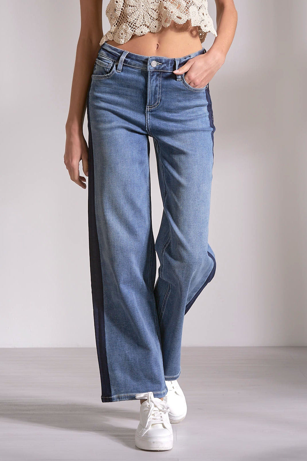 front view on model of the Track Stripe Denim in a medium denim wash