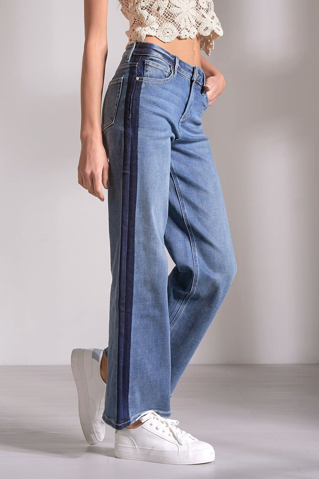 model wearing the medium denim wash, Track Stripe Denim from Mainstream Boutique Bloomington