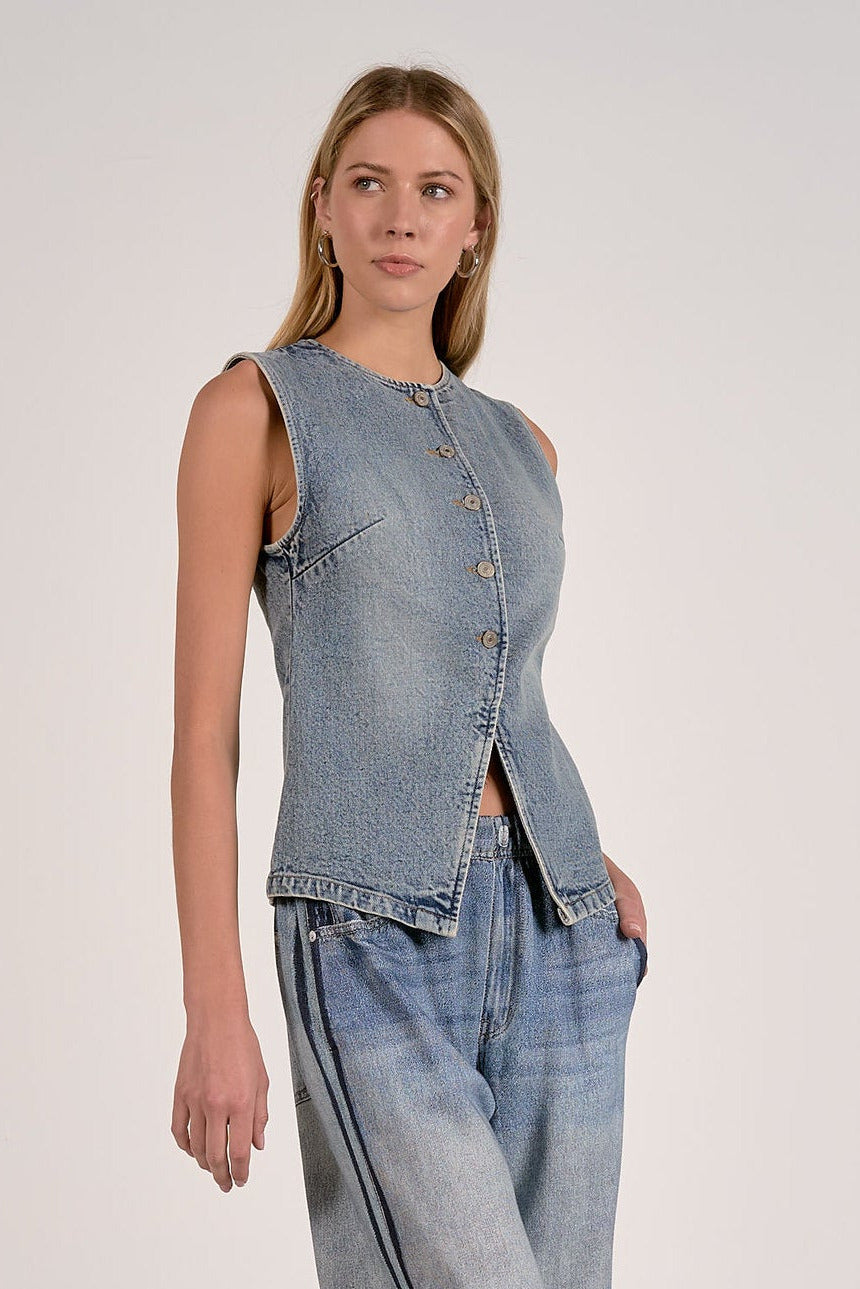 side view of washed denim button front vest with tailored seam detailing
