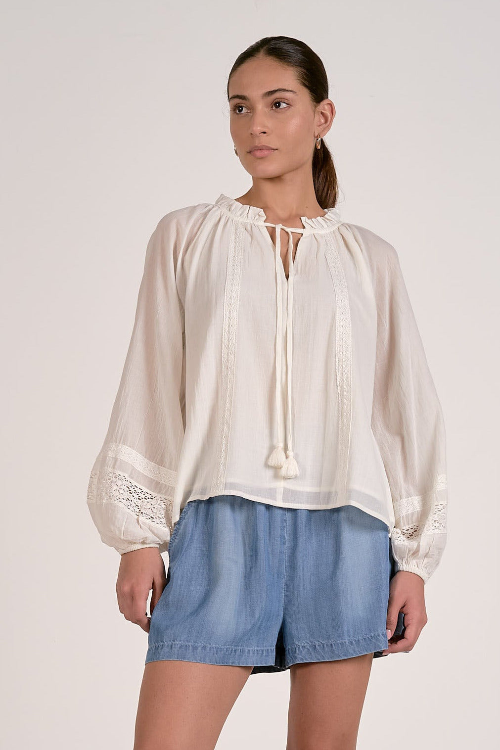 white cotton lace tie front blouse with ruffle neckline front view