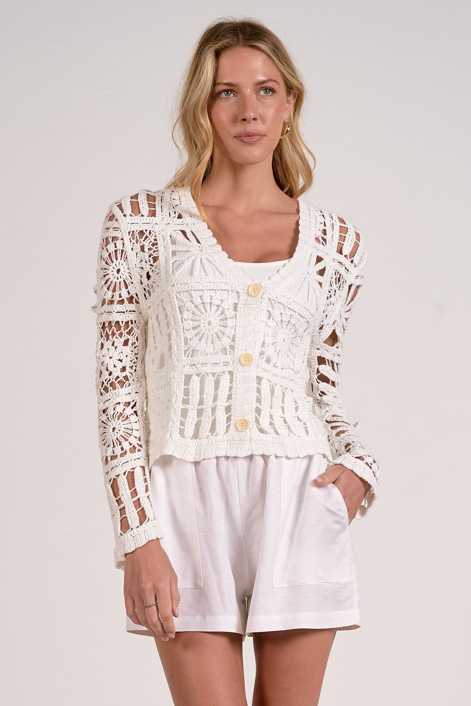 front of white crochet cardigan