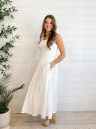 woman modeling the Mixed Media Eyelet Midi Dress in white