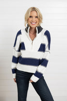 Wide stripe half zip sweater in navy and white with ribbed knit texture and relaxed fit