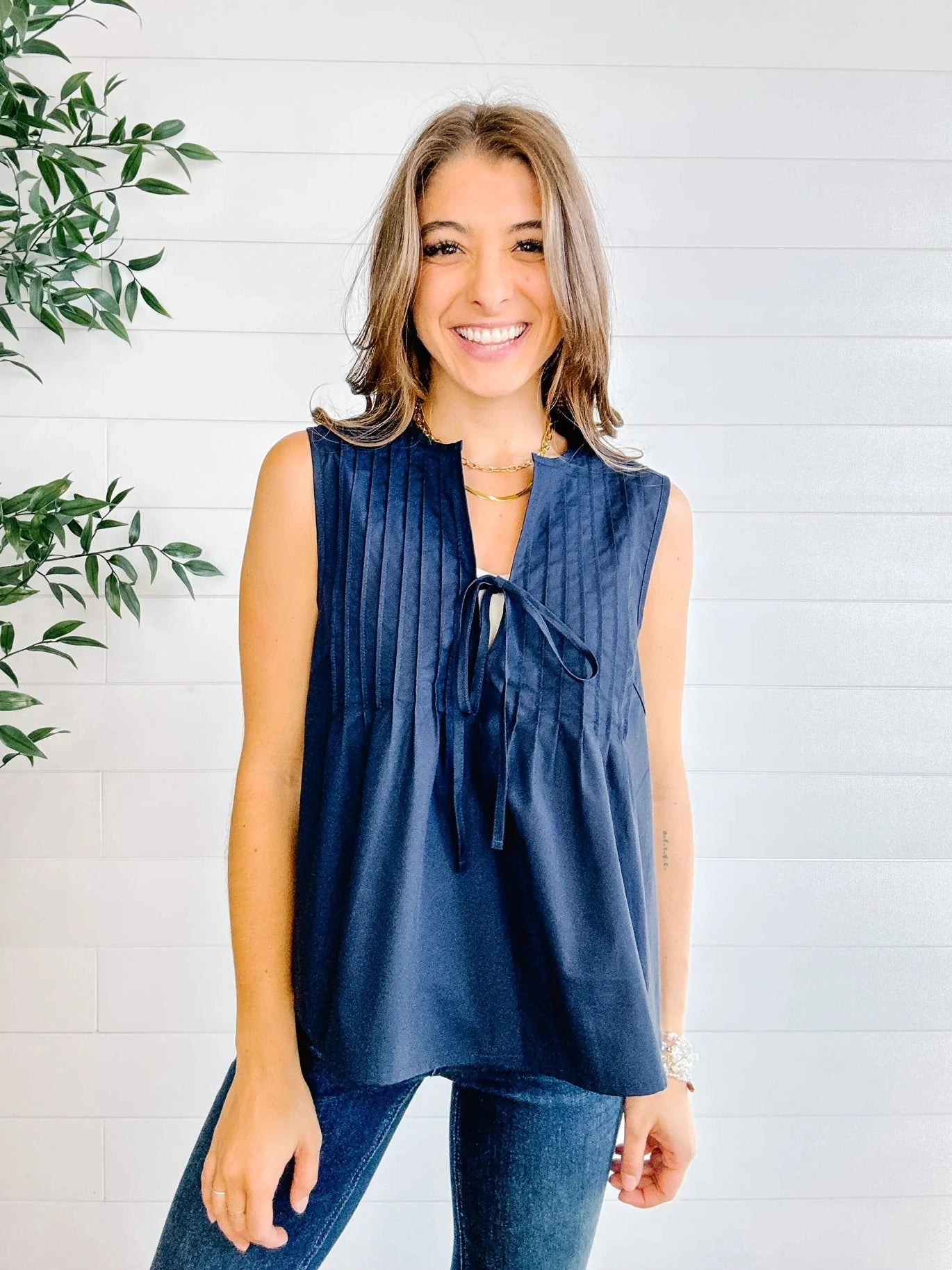 Relaxed fit navy woven top paired with denim